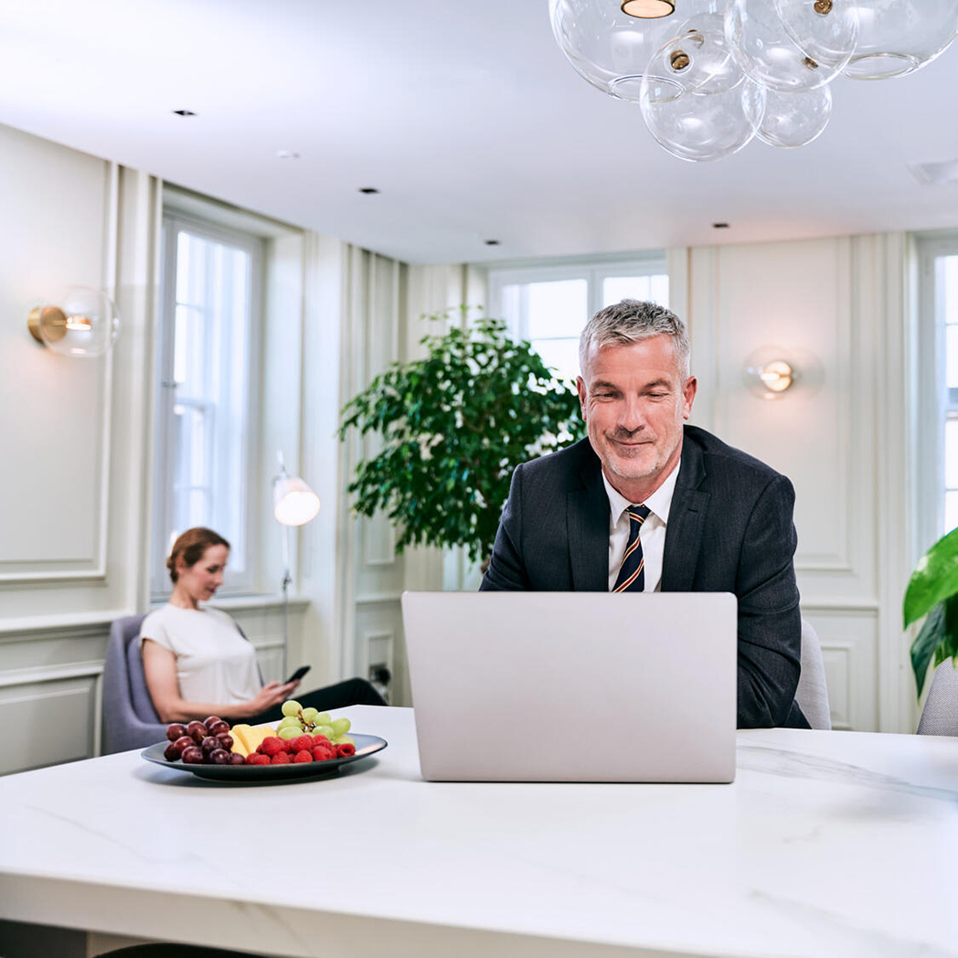 Executives stay productive in an exclusive business lounge.