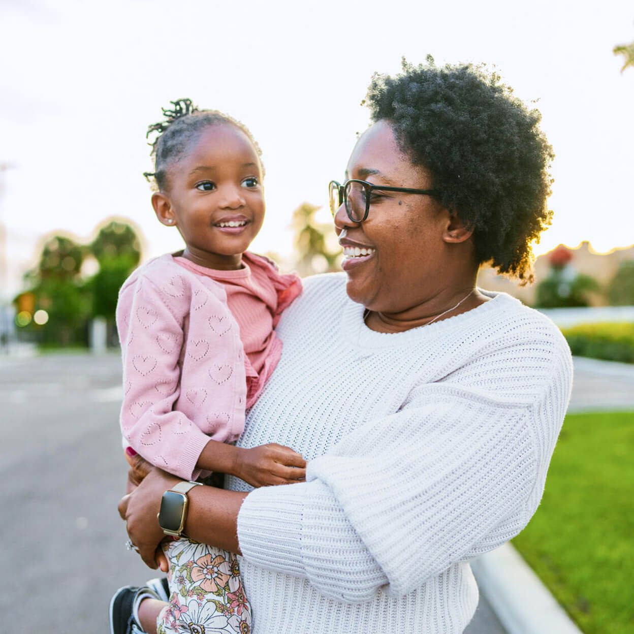 A mother laughs with her daughter